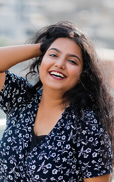 a-positive-indian-girl-smiles-strolling-along-the-2024-09-15-05-07-48-utc (1) (1)