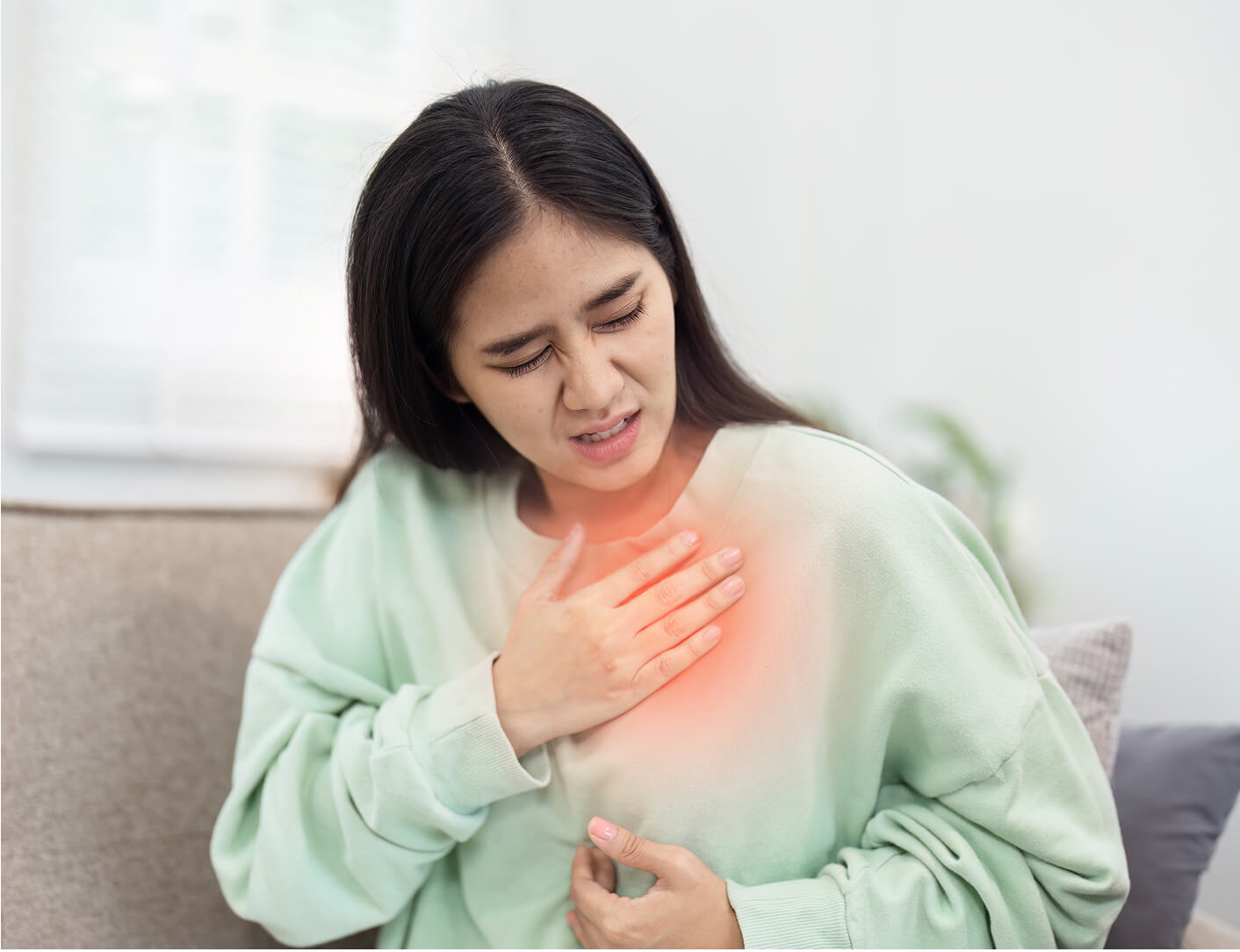 woman-experiencing-chest-pain-at-home-healthcare-2025-02-20-03-20-29-utc (1)